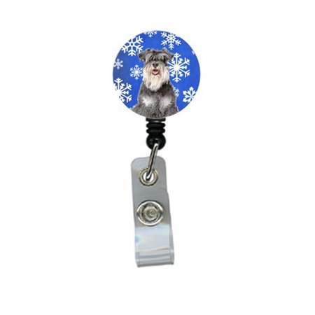 CAROLINES TREASURES Winter Snowflakes Holiday Schnauzer Retractable Badge Reel KJ1178BR